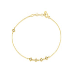 yellow gold Tessera station bracelet on a white background