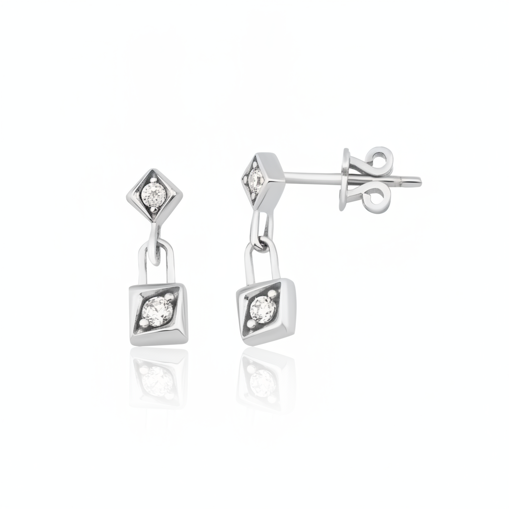 white gold Sora drop earrings on a white background