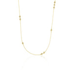 yellow gold Tessera station necklace on a white background