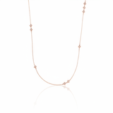 rose gold Tessera station necklace on a white background