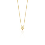 yellow gold Quadra tilted pendant necklace on a white background