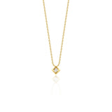 yellow gold Quadra tilted pendant necklace on a white background