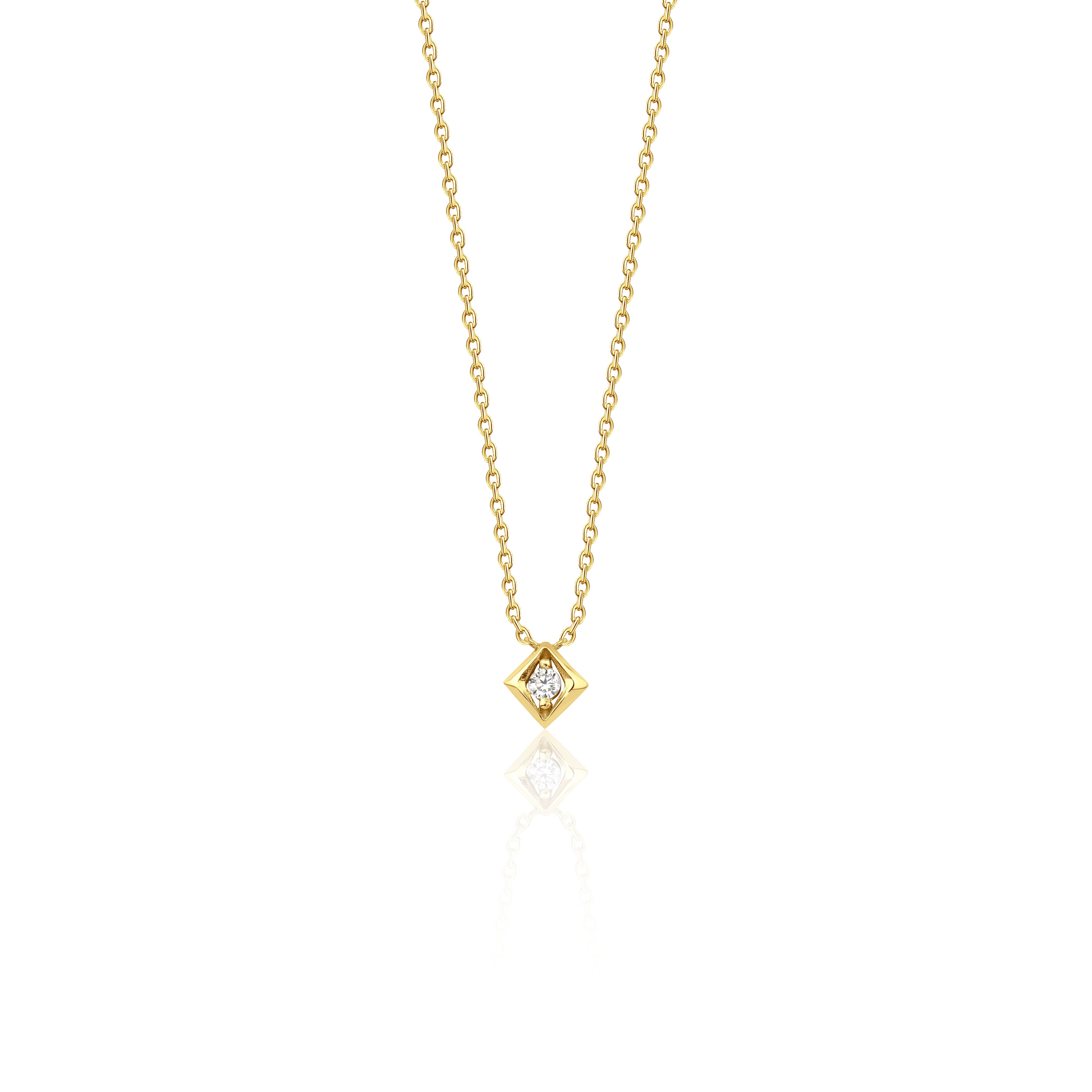 yellow gold Quadra tilted pendant necklace on a white background