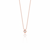 rose gold Quadra tilted pendant necklace on a white background
