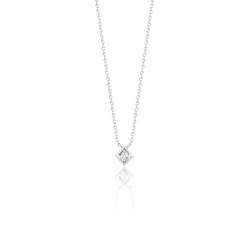 white gold Quadra tilted pendant necklace on a white background