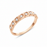 rose gold Quadra row ring on a white background