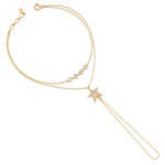 yellow gold Astra hand chain on a white background
