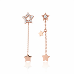 rose gold Astra asymmetrical star drop earrings on a white background