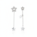 white gold Astra asymmetrical star drop earrings on a white background