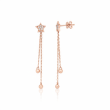 star drop earrings with cascading chains in rose gold on a white background