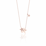 star cluster necklace in rose gold on a white background