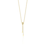 star drop necklace in yellow gold on a white background
