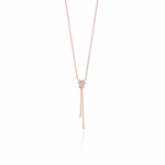 star drop necklace in rose gold on a white background