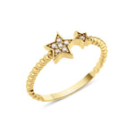 twin star ring in yellow gold on a white background