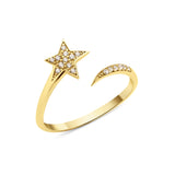 open star ring with a trailing arc in yellow gold on a white background