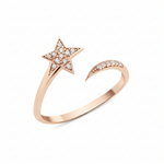 open star ring with a trailing arc in rose gold on a white background