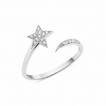 open star ring with a trailing arc in white gold on a white background
