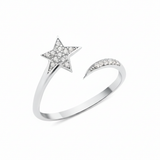 open star ring with a trailing arc in white gold on a white background