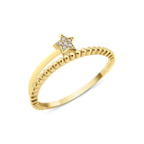 textured star band ring in yellow gold on a white background