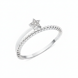 textured star band ring in white gold on a white background