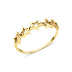 openwork star silhouette ring in yellow gold on a white background