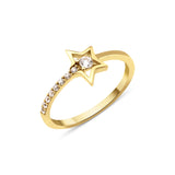 open star ring with a stone trail in yellow gold on a white background