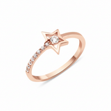 open star ring with a stone trail in rose gold on a white background