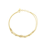 double-strand beaded chain bracelet in yellow gold on a white background