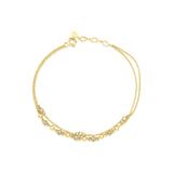 double-strand beaded chain bracelet in yellow gold on a white background