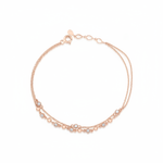 double-strand beaded chain bracelet in rose gold on a white background