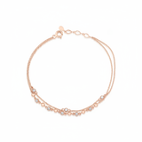 double-strand beaded chain bracelet in rose gold on a white background