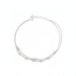 double-strand beaded chain bracelet in white gold on a white background