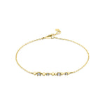 beaded bar chain bracelet in yellow gold on a white background