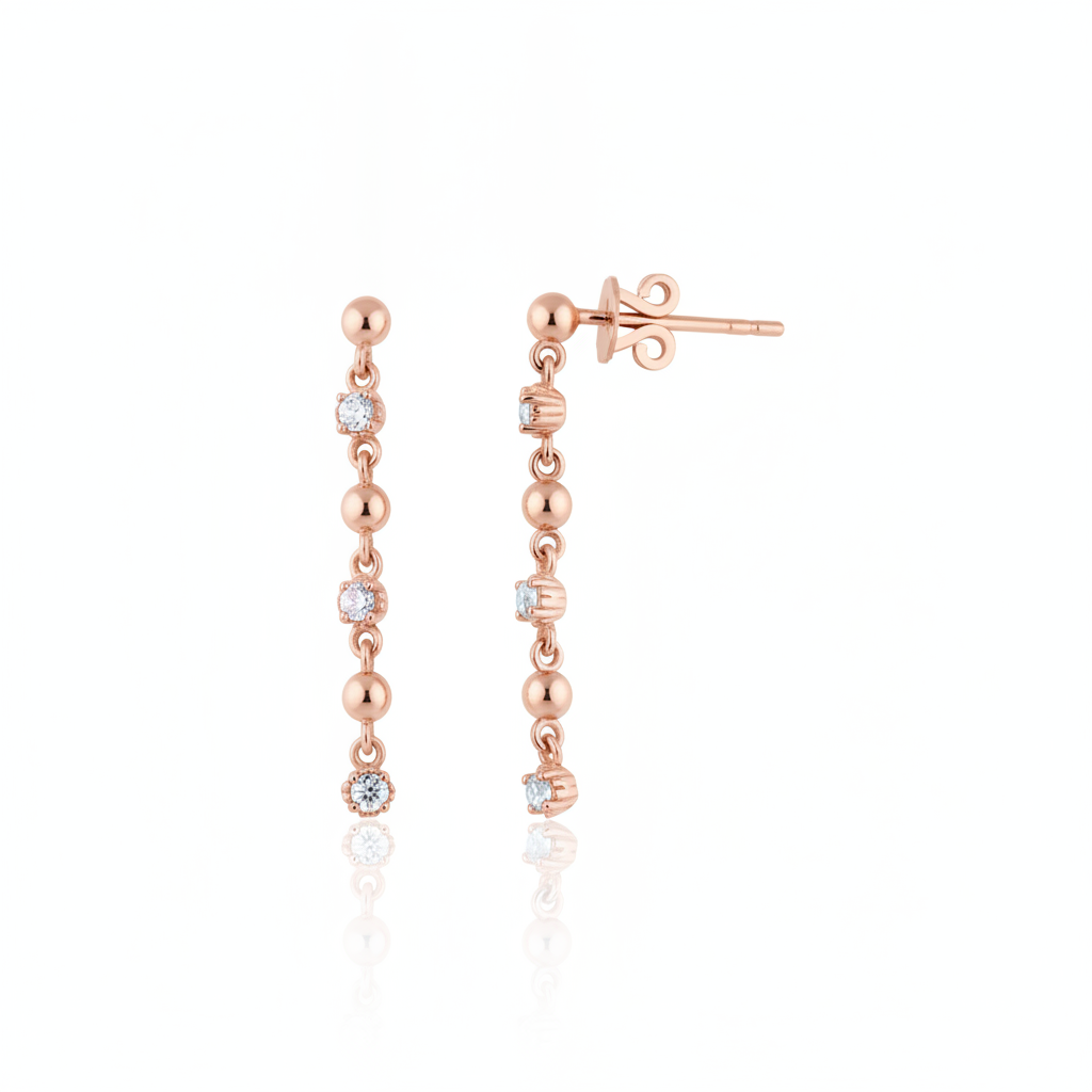 linear drop earrings in rose gold on a white background