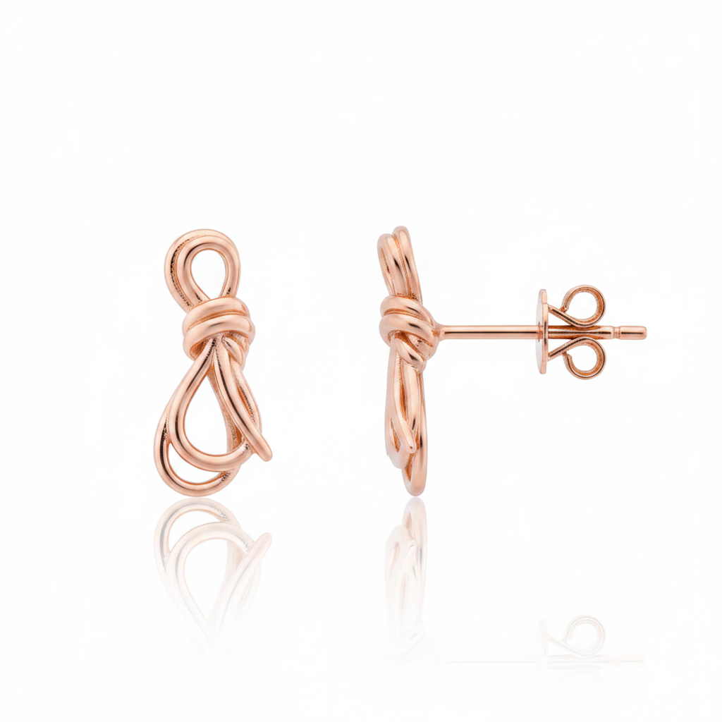 knot stud earrings in rose gold on a white background