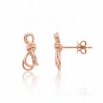 knot stud earrings in rose gold on a white background