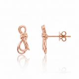 knot stud earrings in rose gold on a white background