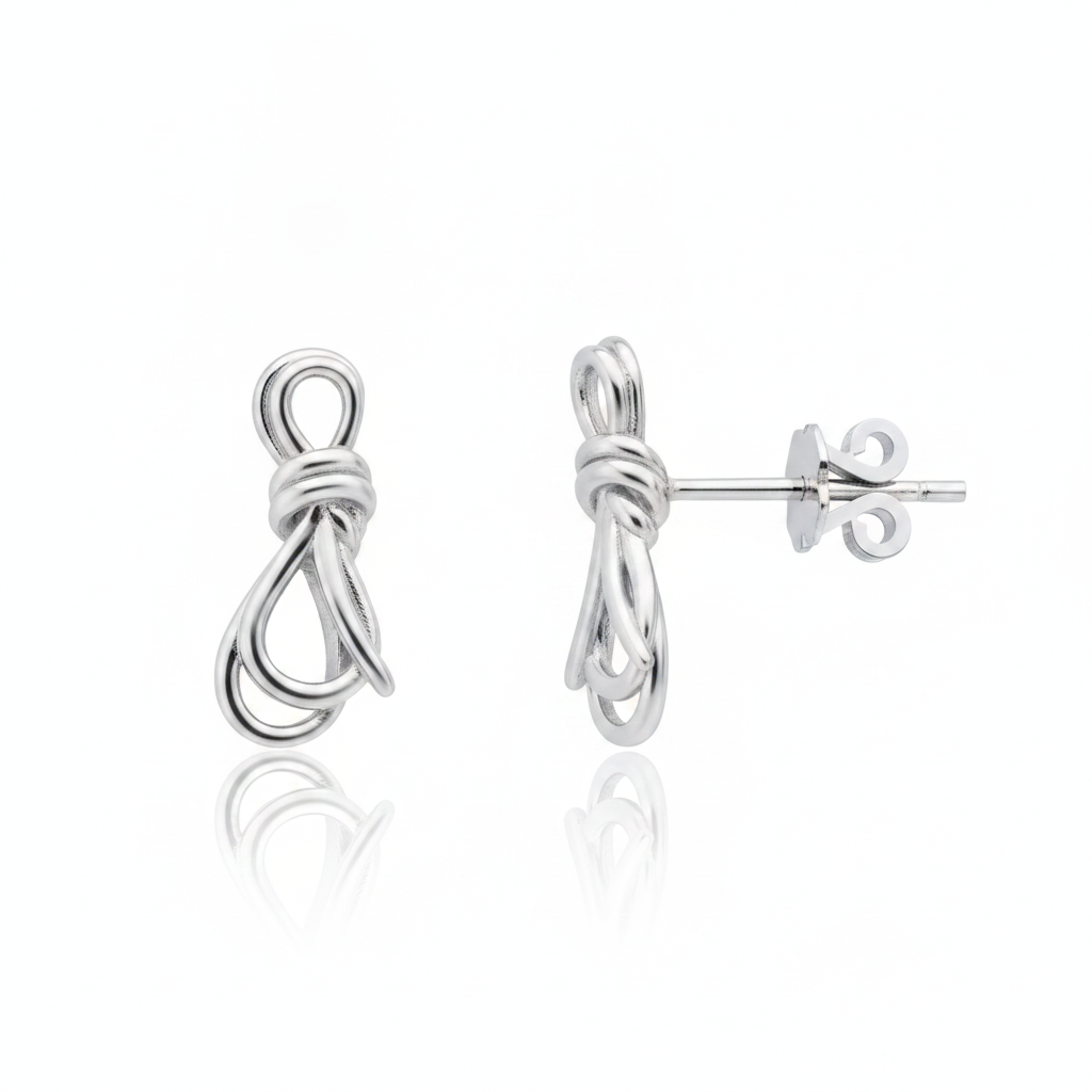 knot stud earrings in white gold on a white background