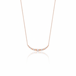beaded arc necklace in rose gold on a white background