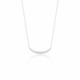 beaded arc necklace in white gold on a white background