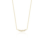 leaf arc necklace in yellow gold on a white background