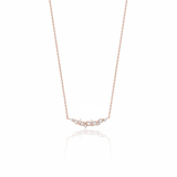 leaf arc necklace in rose gold on a white background