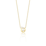 circle pendant necklace in yellow gold on a white background