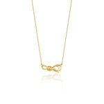 yellow gold ribbon knot necklace on white background