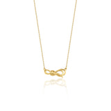 yellow gold ribbon knot necklace on white background