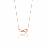 rose gold ribbon knot necklace on white background
