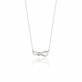white gold ribbon knot necklace on white background