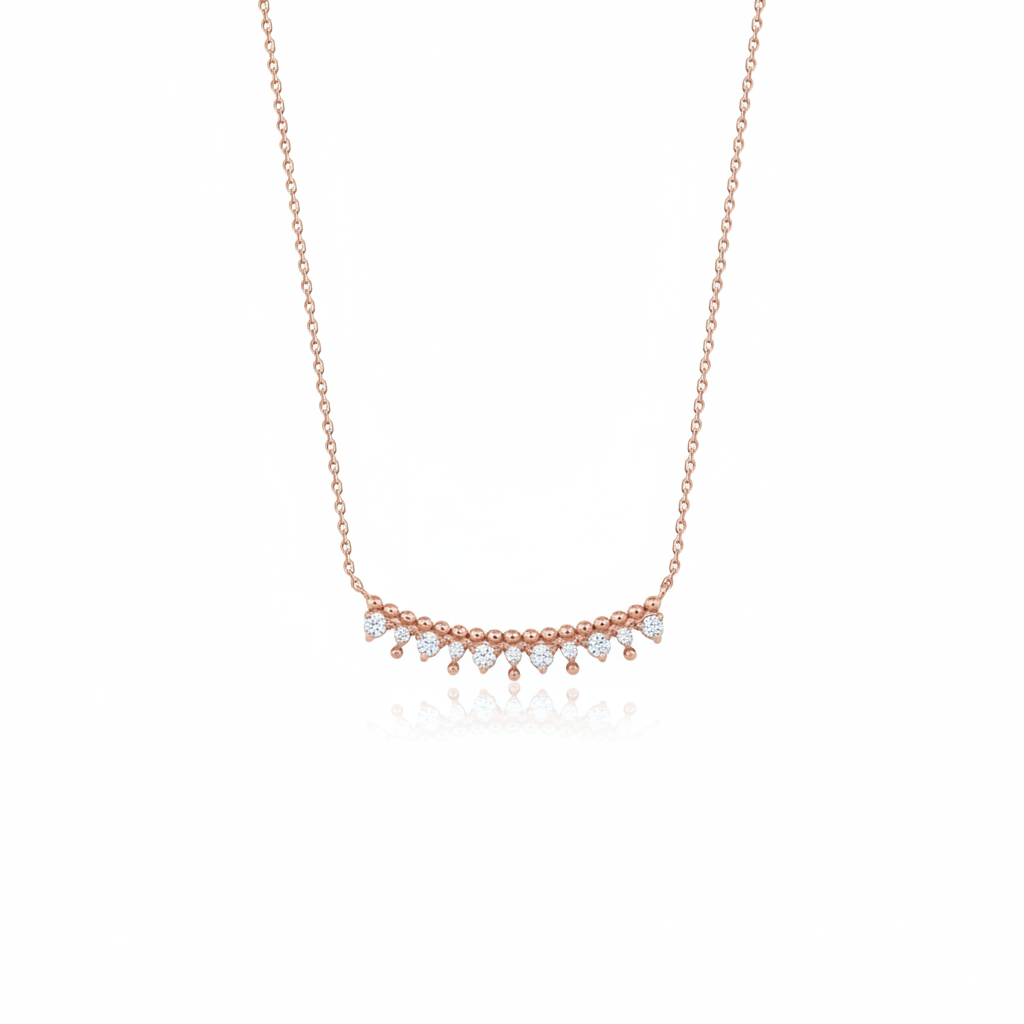 rose gold beaded arc necklace on white background