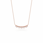 rose gold beaded arc necklace on white background