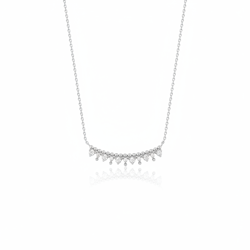 white gold beaded arc necklace on white background